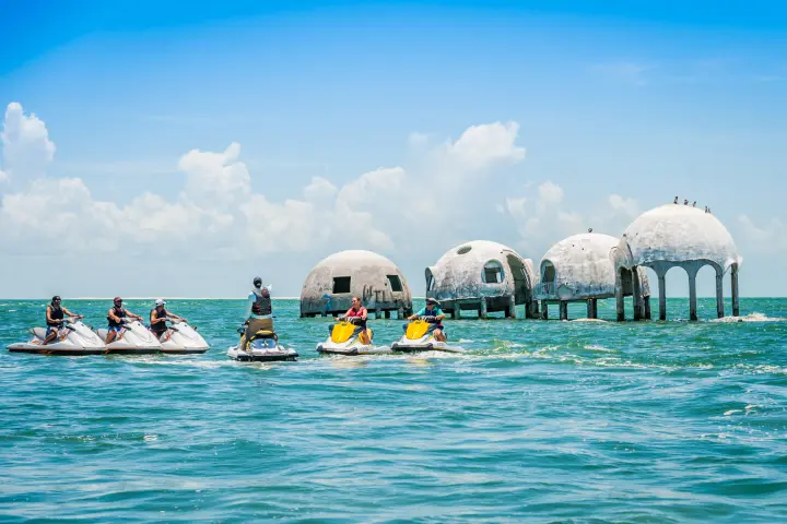 a group of people on jet skis in the water