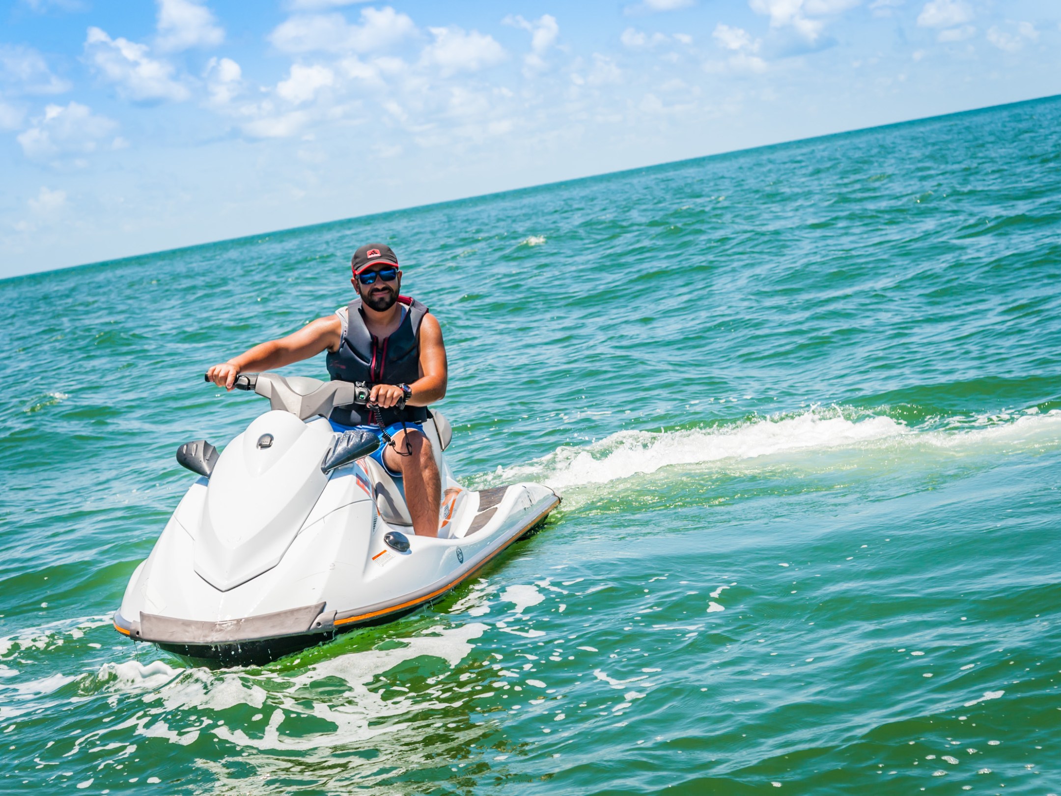 a man riding a jet ski in the Gulf of Mexico